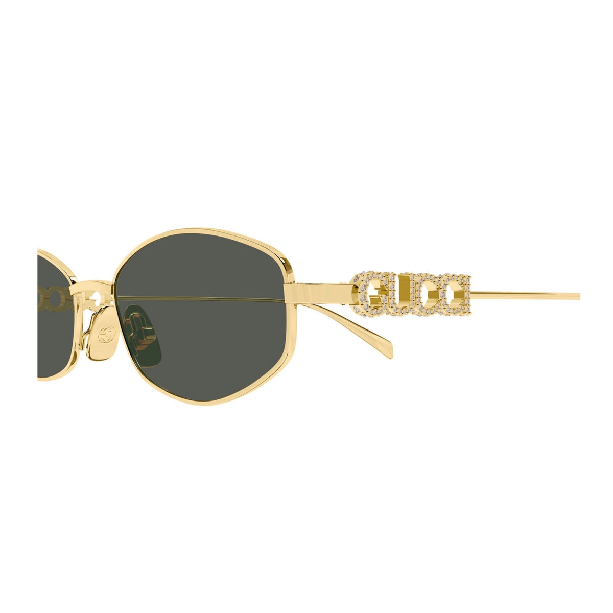 Close-up of the Gucci logo on the temple of the GG1802S gold oval sunglasses