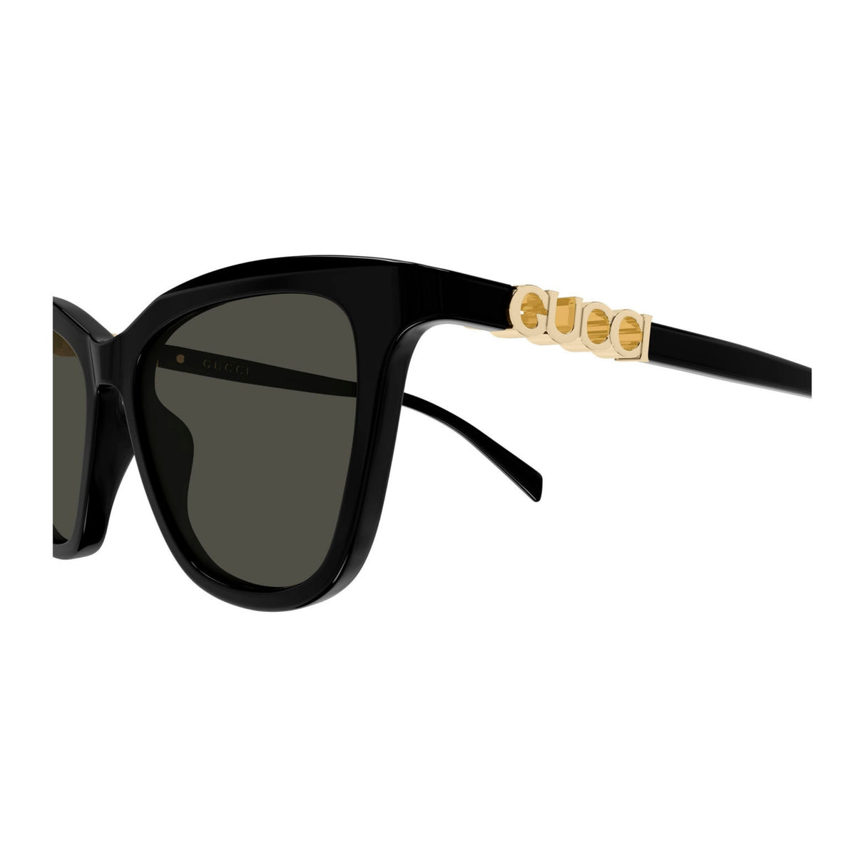 Close-up of the Gucci logo on the temple of the GG2032S black cat-eye sunglasses
