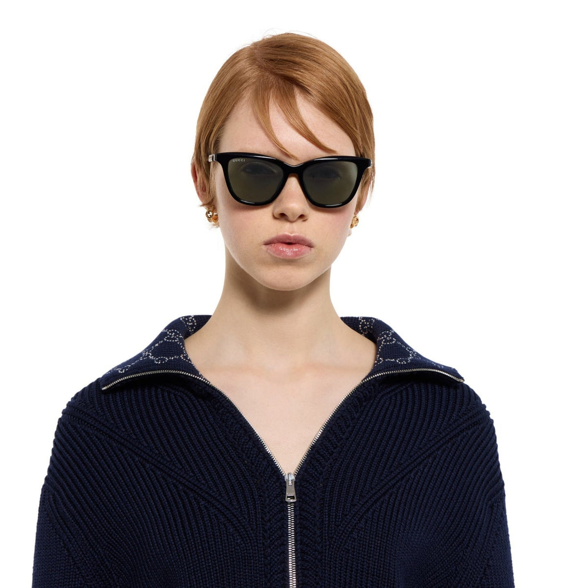 Woman wearing Gucci GG2032S black cat-eye sunglasses, another view