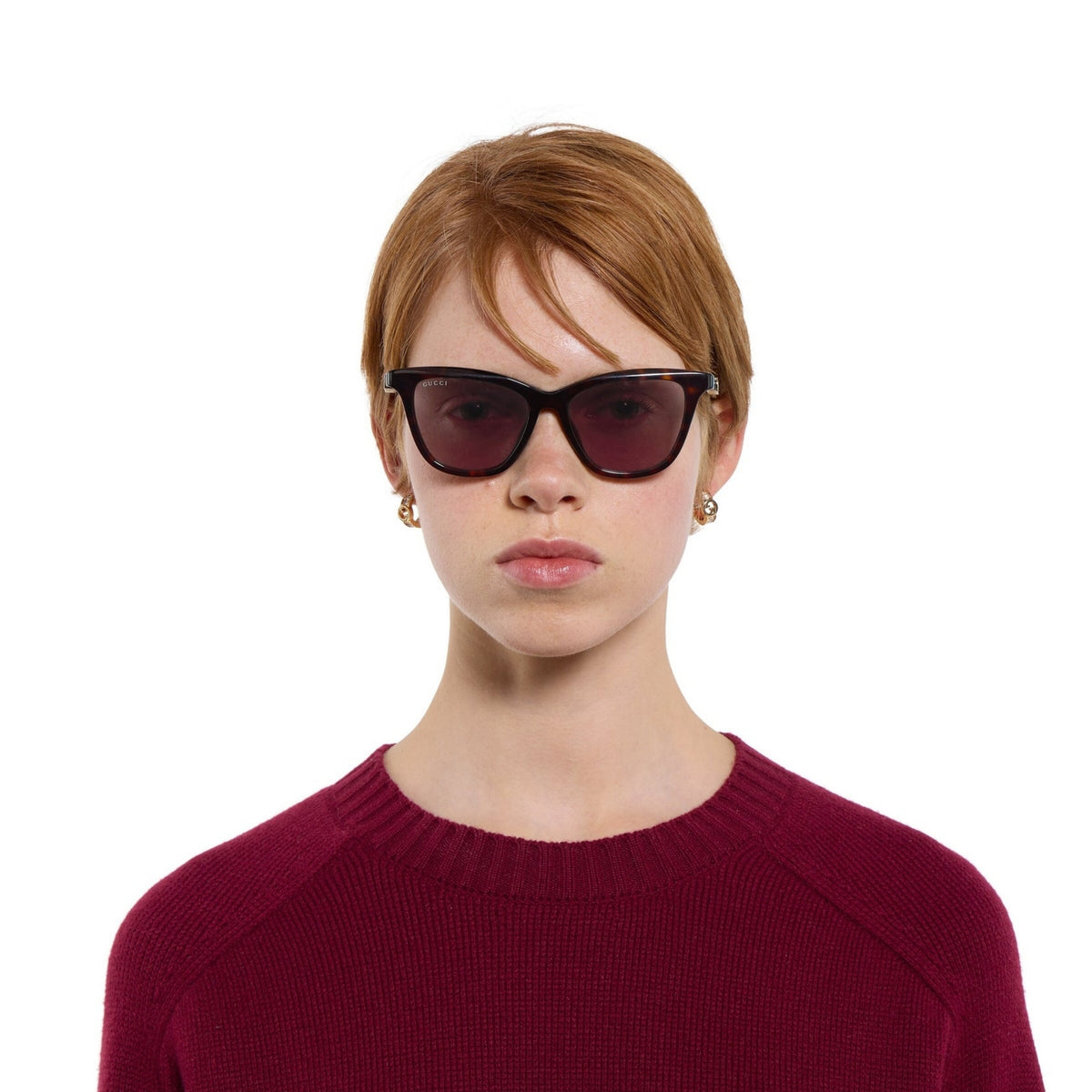 Woman wearing Gucci GG2032S havana cat-eye sunglasses, another view