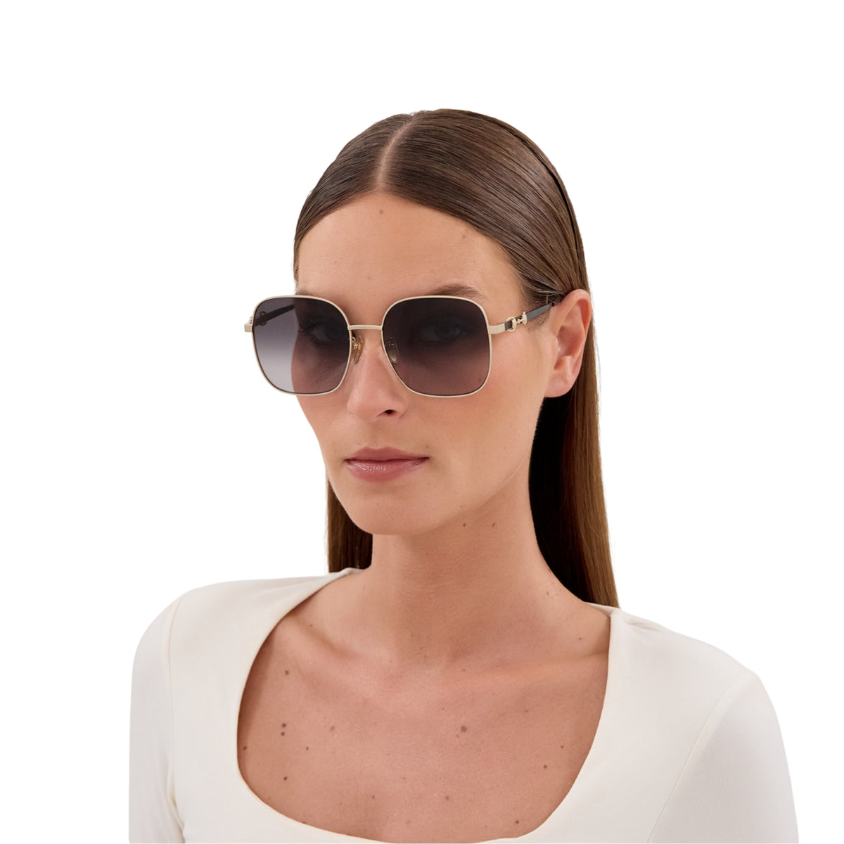 Woman wearing Gucci GG2053S gold square sunglasses