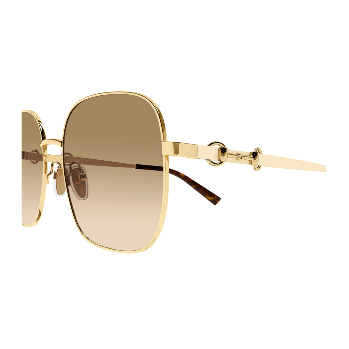 Close-up of the Gucci logo on the temple of the GG2053S gold square sunglasses