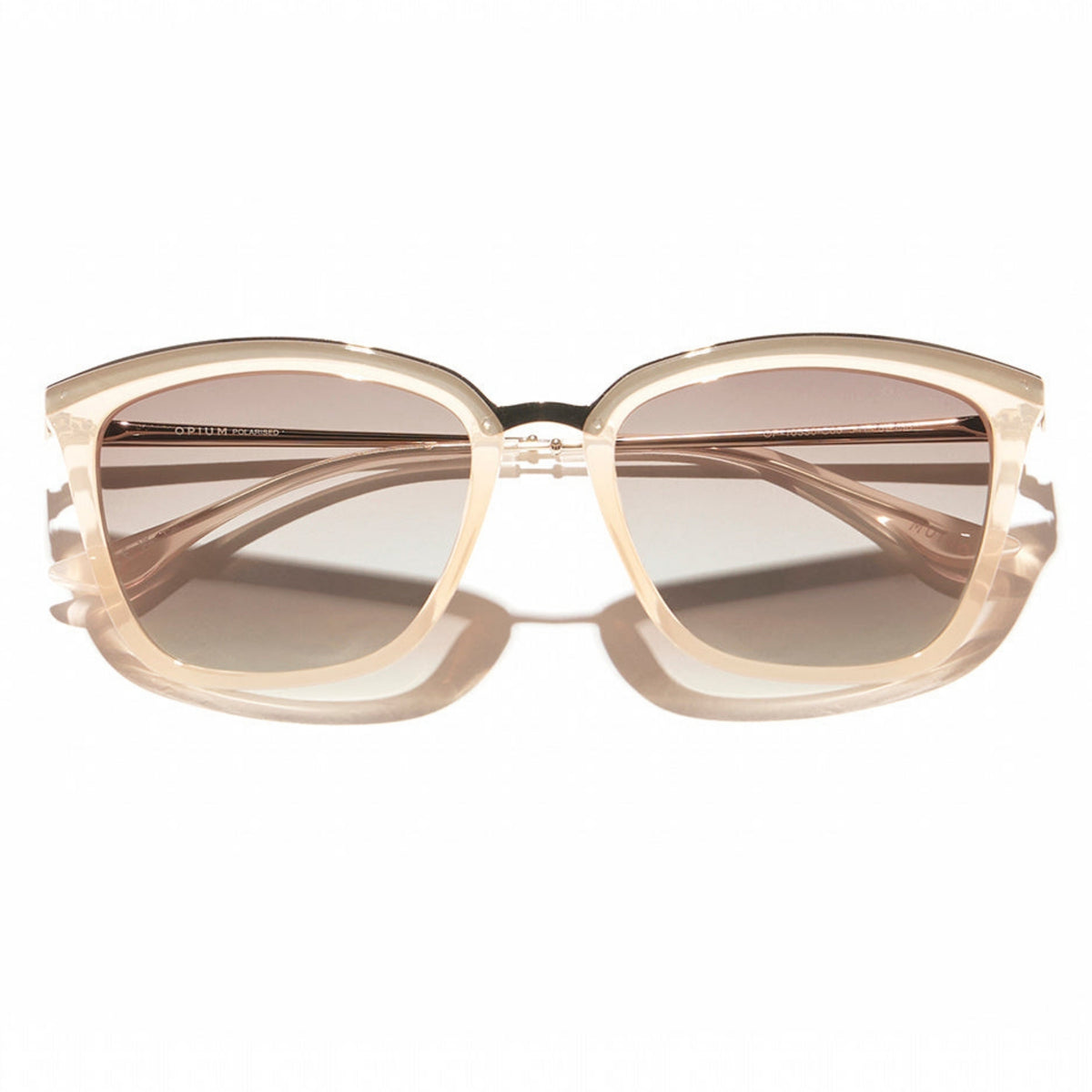 Opium OP10330 gold cat-eye sunglasses, front view with the temples folded