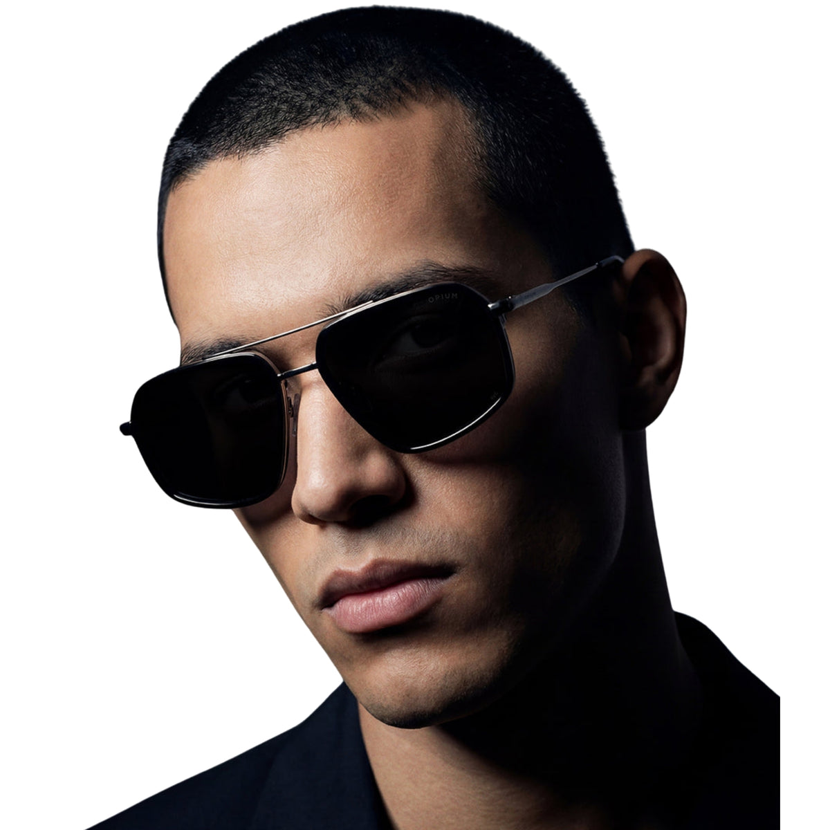 Man wearing Opium OP10433 gunmetal aviator sunglasses