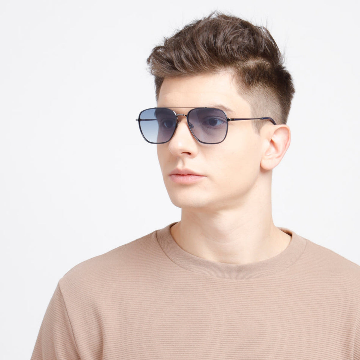 Man wearing Opium OP2038 gunmetal aviator sunglasses